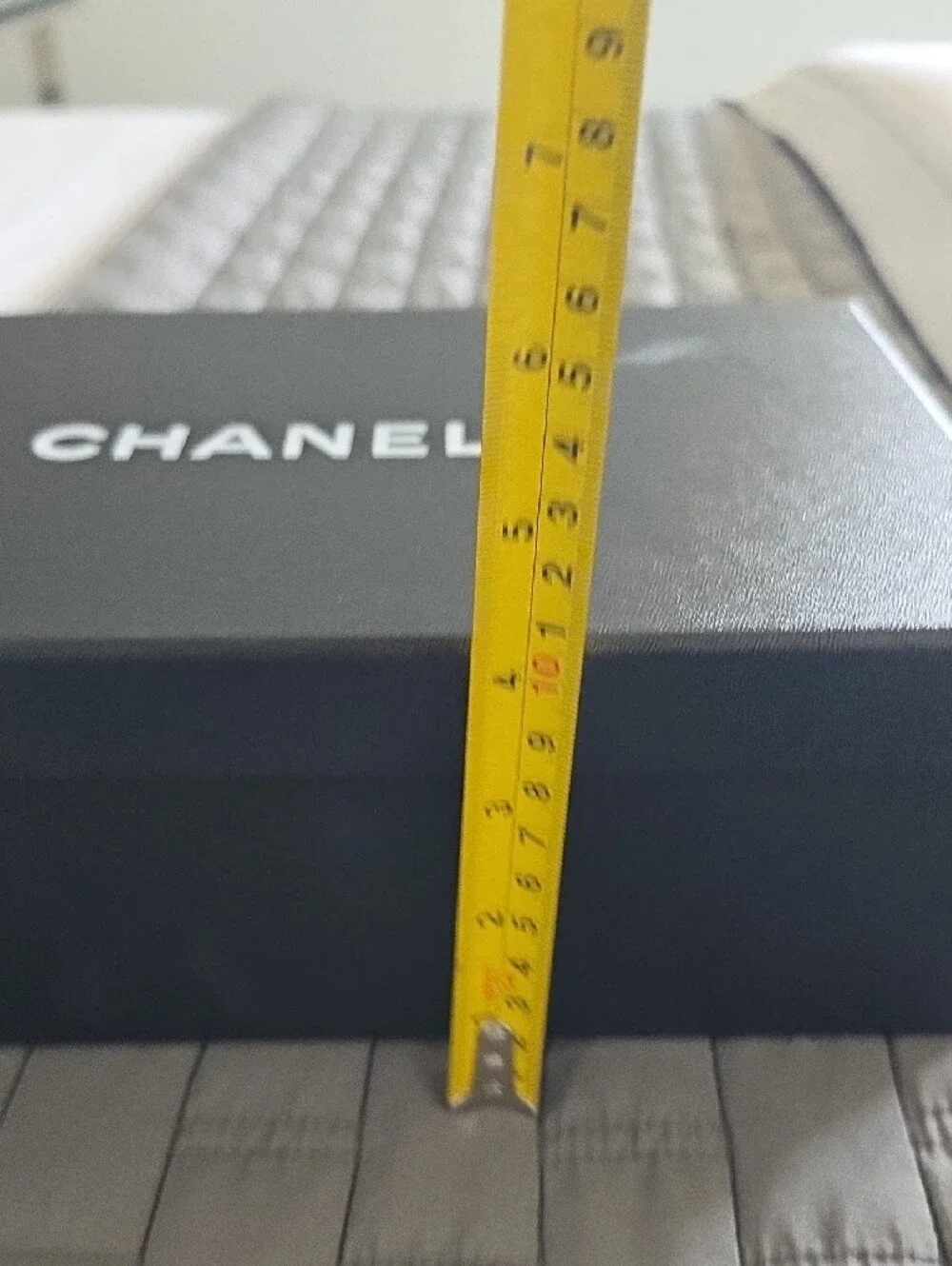 CHANEL Black Box with White Ribbon and Camellia Accent